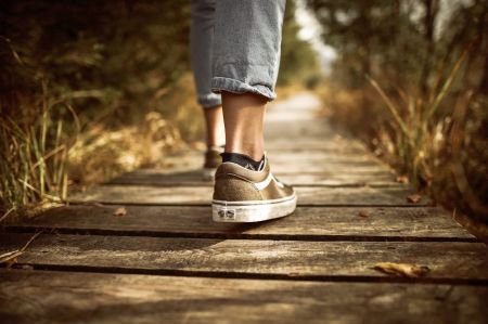 image of woman's shoes walking away